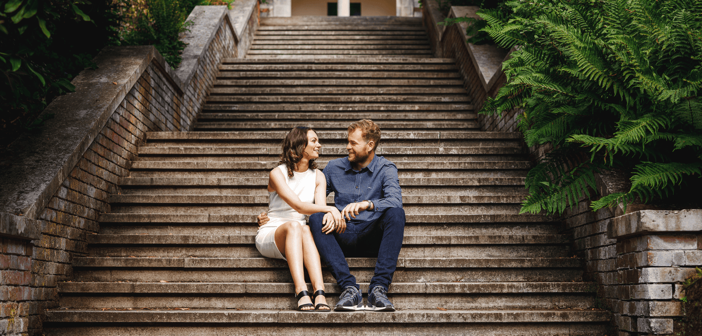 Newly engaged couple on steps