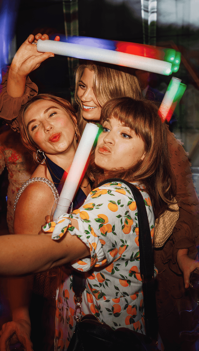 Girls with lightstick at wedding